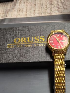 Russ Women's Gold Bracelet Watch with Red Dial
